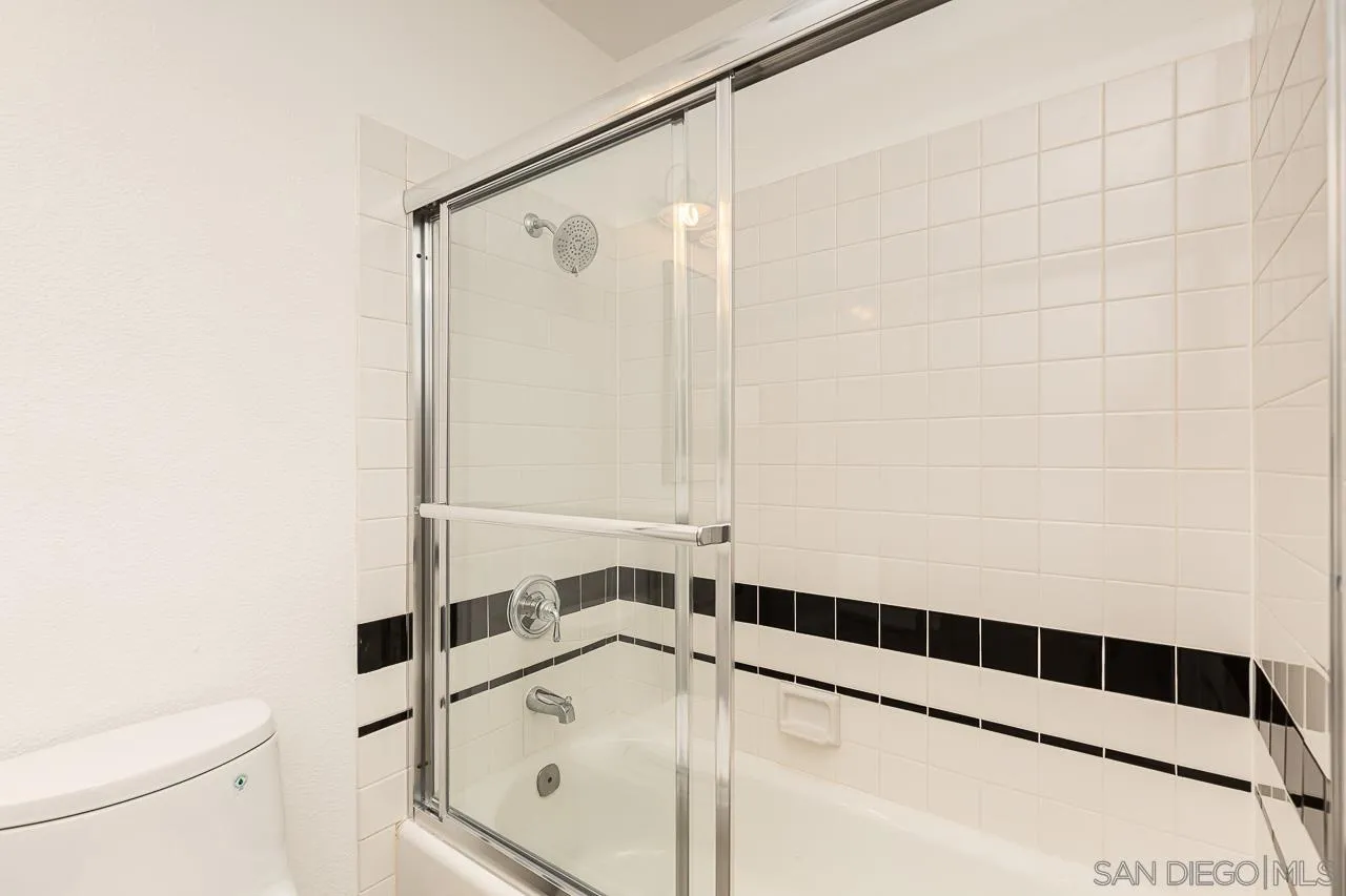 8065 Caminito Gianna La Jolla, CA 92037 - Photo 22 of 27 a bathroom with a shower and a sink