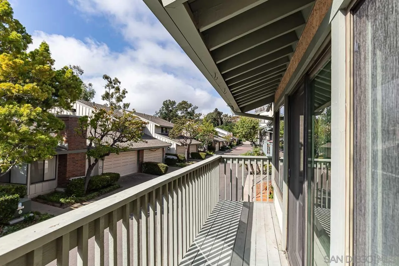 8065 Caminito Gianna La Jolla, CA 92037 - Photo 25 of 27 a balcony with wooden floor