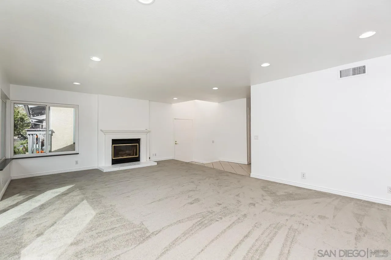 8065 Caminito Gianna La Jolla, CA 92037 - Photo 6 of 27 a view of empty room with a fireplace