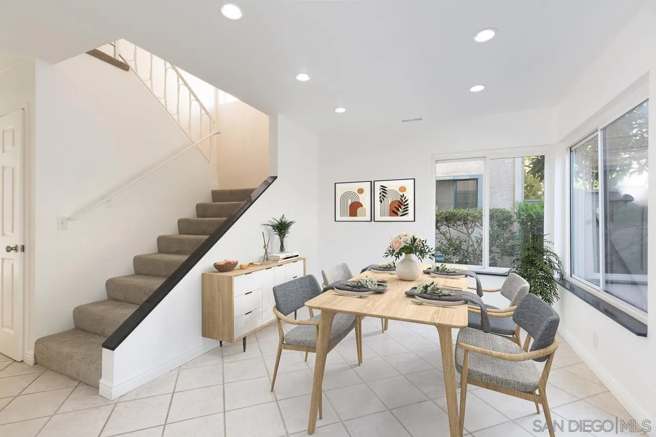 8065 Caminito Gianna La Jolla, CA 92037 - Photo 9 of 27 a dining room with furniture and wooden floor