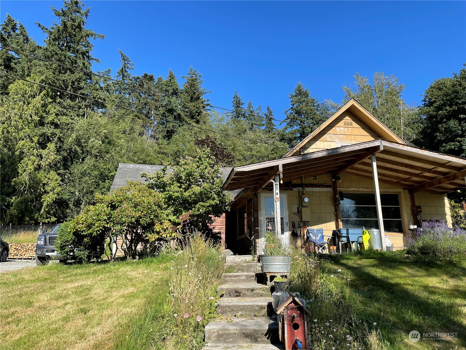 a front view of a house with garden