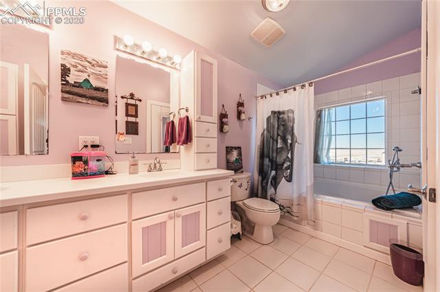3250 North Rush Road Rush, CO 80833 - Photo 23 of 35 Full upper bath has entrance in hall and master bedroom. Enjoy the large garden tub as you look out over the prairie.