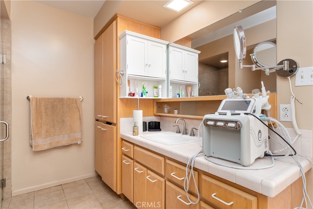 4967 Chapala Drive Riverside, CA 92507 - Photo 23 of 34 a kitchen with a stove and a sink