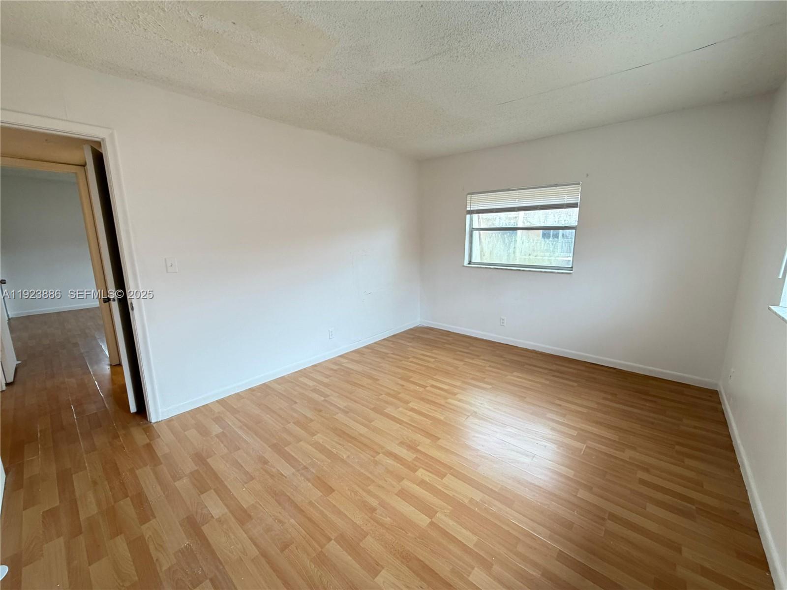 5327 Northwest 27th Street, Unit D4 Lauderhill, FL 33313 - Photo 14 of 14 a view of empty room with wooden floor