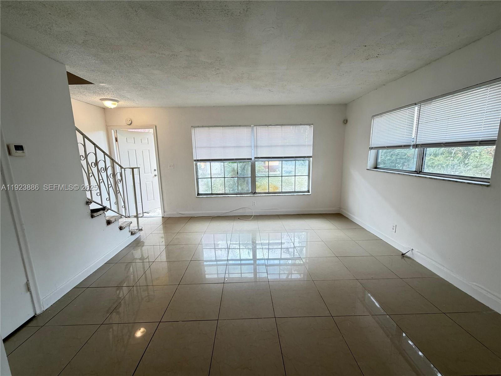 5327 Northwest 27th Street, Unit D4 Lauderhill, FL 33313 - Photo 8 of 14 a view of an empty room with a window
