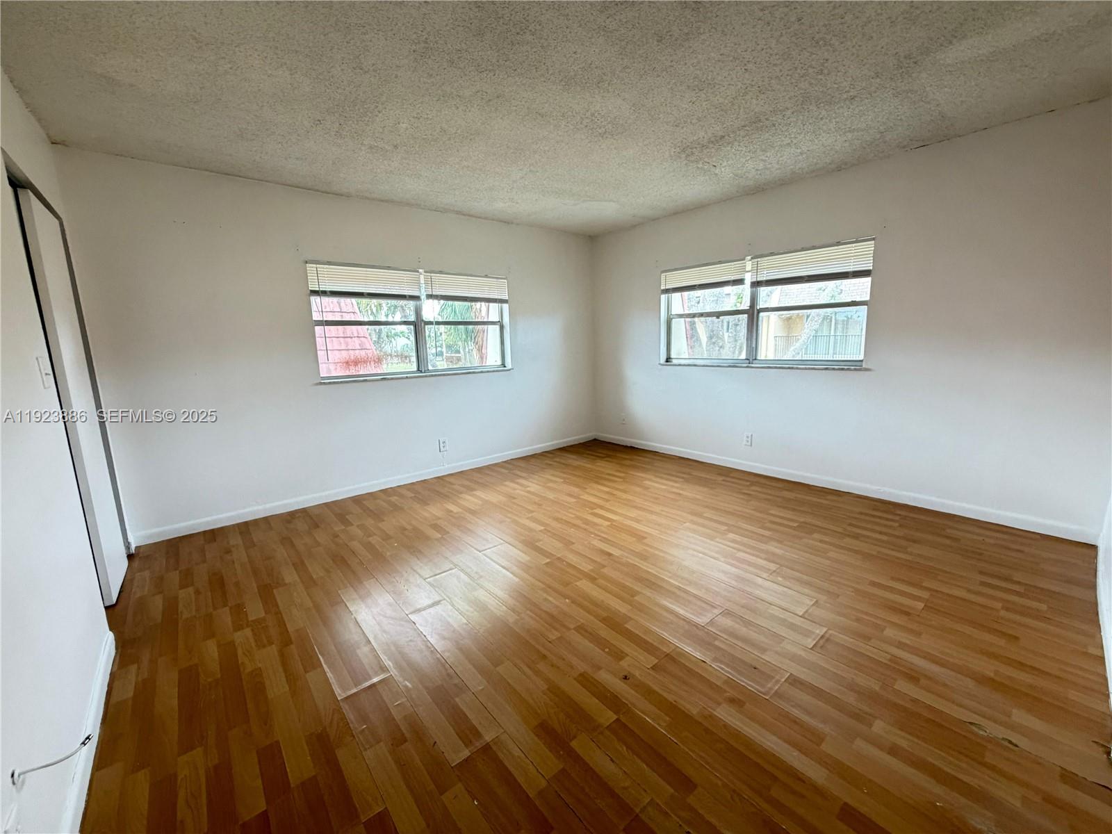 5327 Northwest 27th Street, Unit D4 Lauderhill, FL 33313 - Photo 10 of 14 a view of empty room with wooden floor