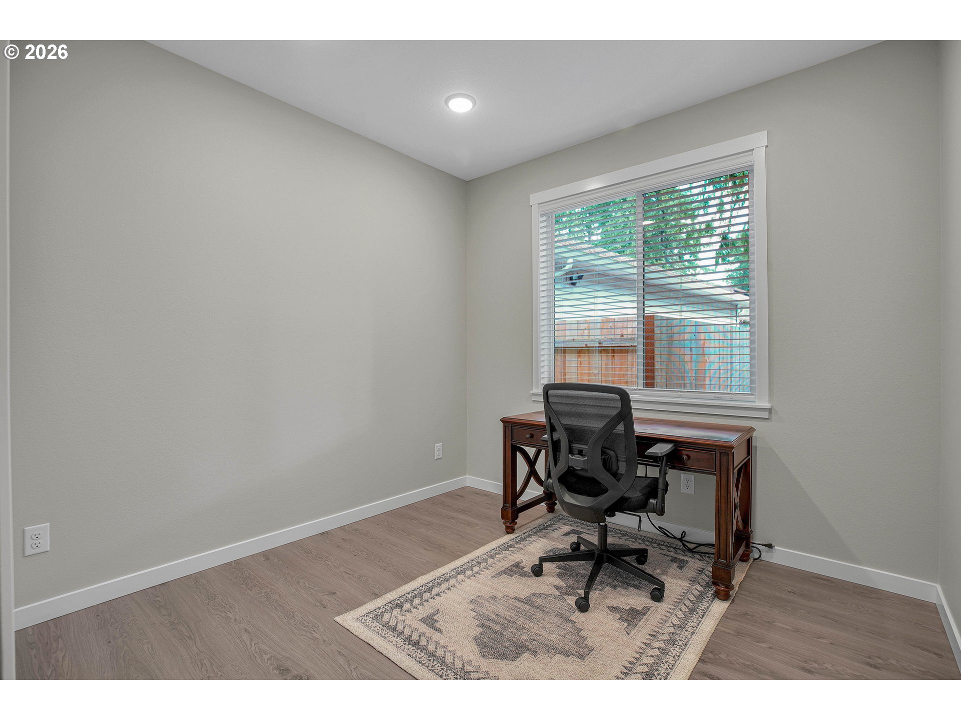 2308 Southeast Risley Avenue Milwaukie, OR 97267 - Photo 13 of 28 a work room with wooden floor and a window
