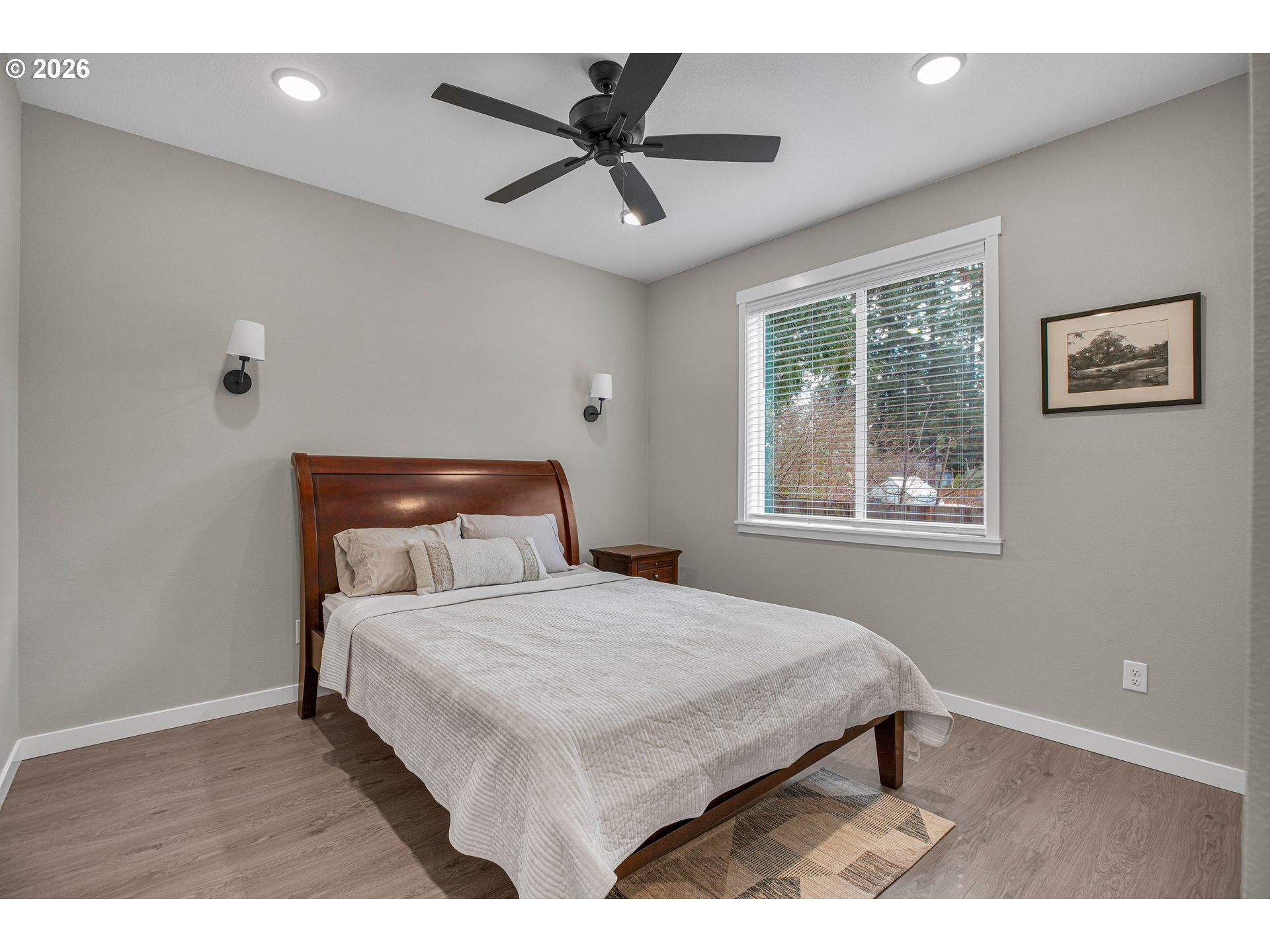 2308 Southeast Risley Avenue Milwaukie, OR 97267 - Photo 15 of 28 a bedroom with a bed and a window