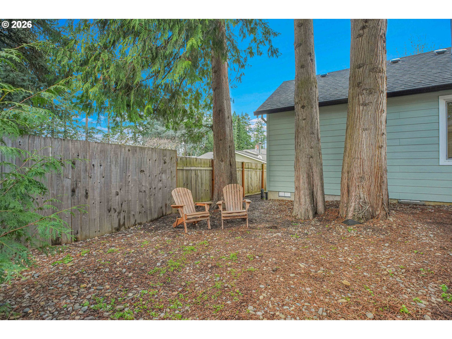 2308 Southeast Risley Avenue Milwaukie, OR 97267 - Photo 19 of 28 a backyard of a house with chairs and table