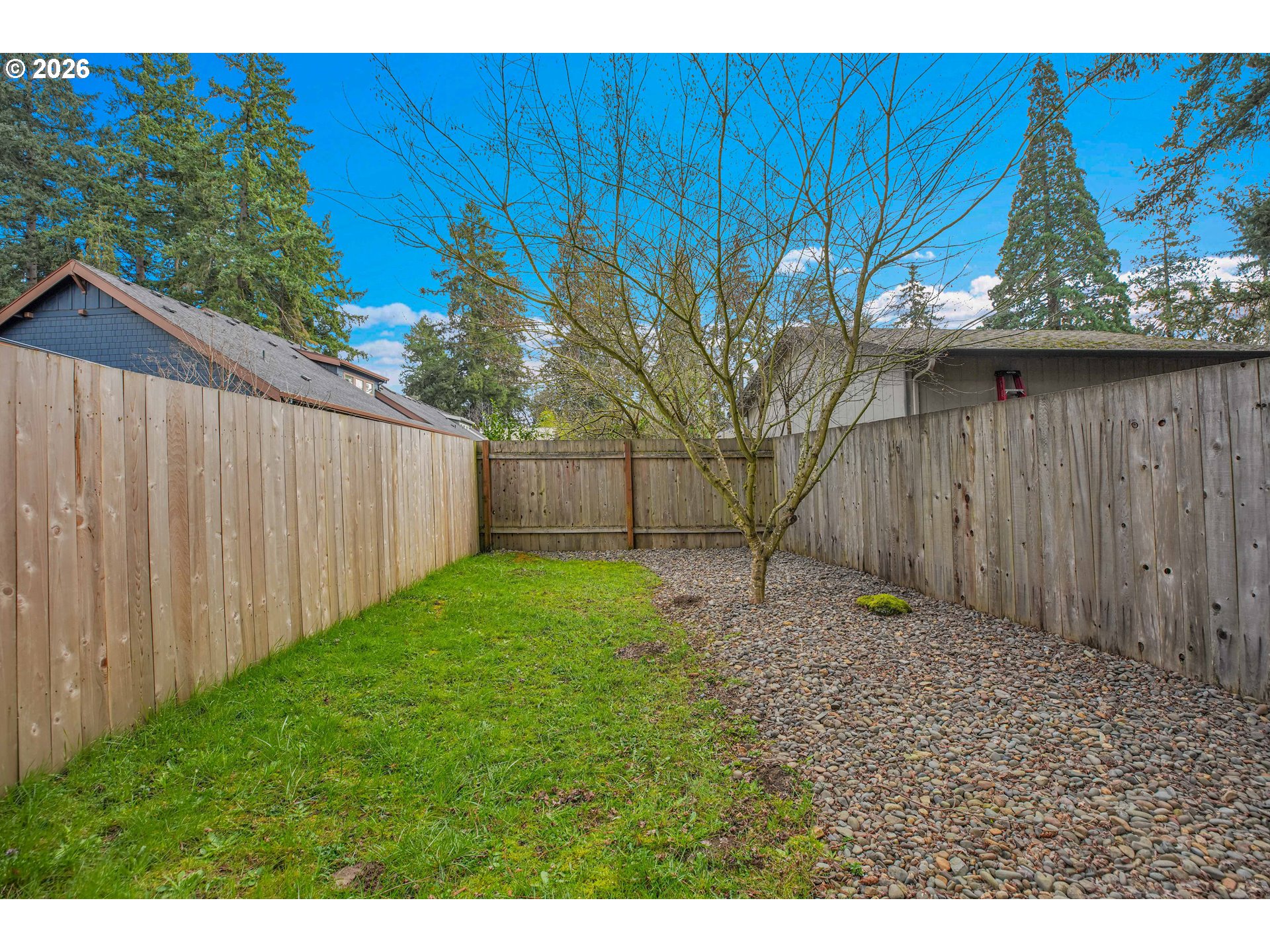 2308 Southeast Risley Avenue Milwaukie, OR 97267 - Photo 20 of 28 a backyard of a house with lots of green space