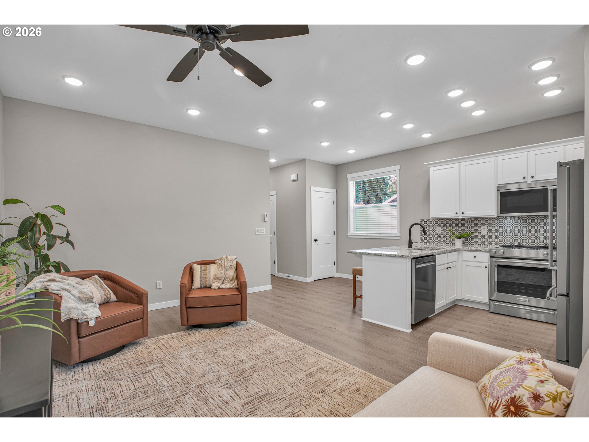 2308 Southeast Risley Avenue Milwaukie, OR 97267 - Photo 5 of 28 a living room with furniture and kitchen view