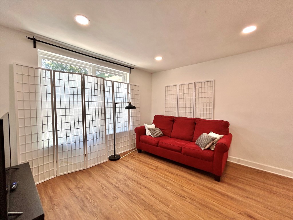 2309 Devonshire Drive, Unit A Austin, TX 78723 - Photo 29 of 39 Living room with light wood finished floors and recessed lighting