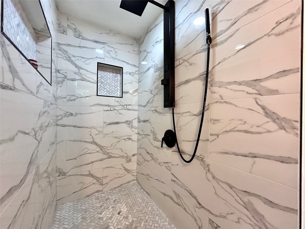 2309 Devonshire Drive, Unit A Austin, TX 78723 - Photo 33 of 39 Full bathroom featuring a marble finish shower