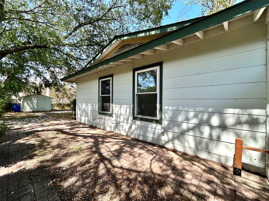 2309 Devonshire Drive, Unit A Austin, TX 78723 - Photo 4 of 39 View of side of home with a shed