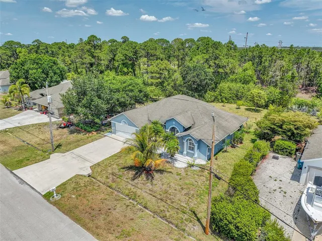 an aerial view of a house with a garden