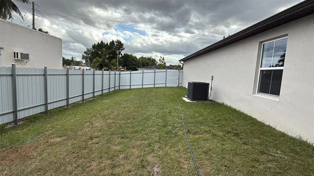 a backyard of a house with lots of green space
