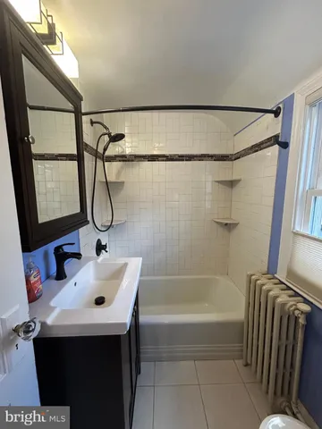 a bathroom with a sink and a bathtub