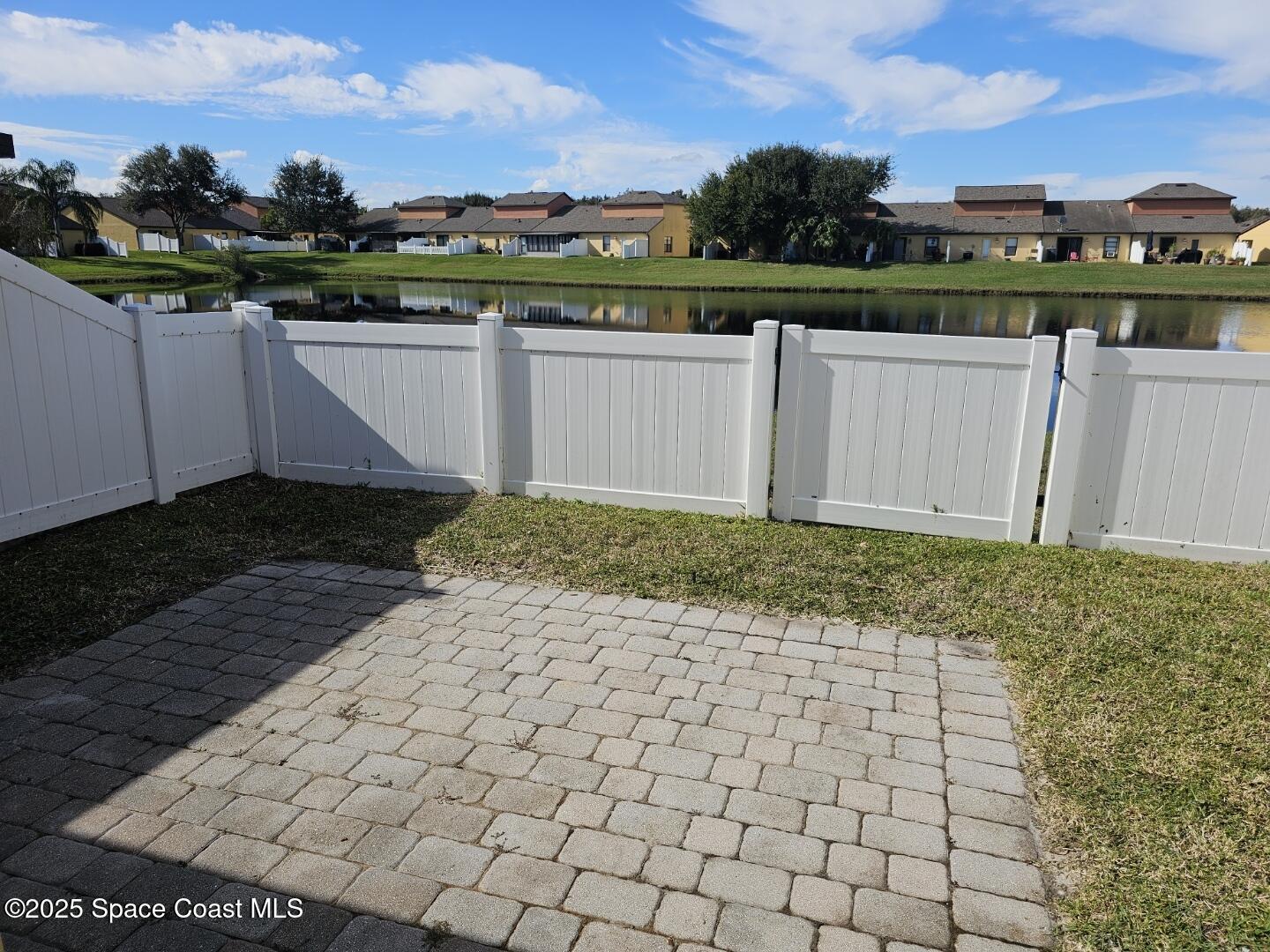 4570 Radiant Way, Unit 104 Melbourne, FL 32901 - Photo 28 of 41 a view of a terrace with a bench