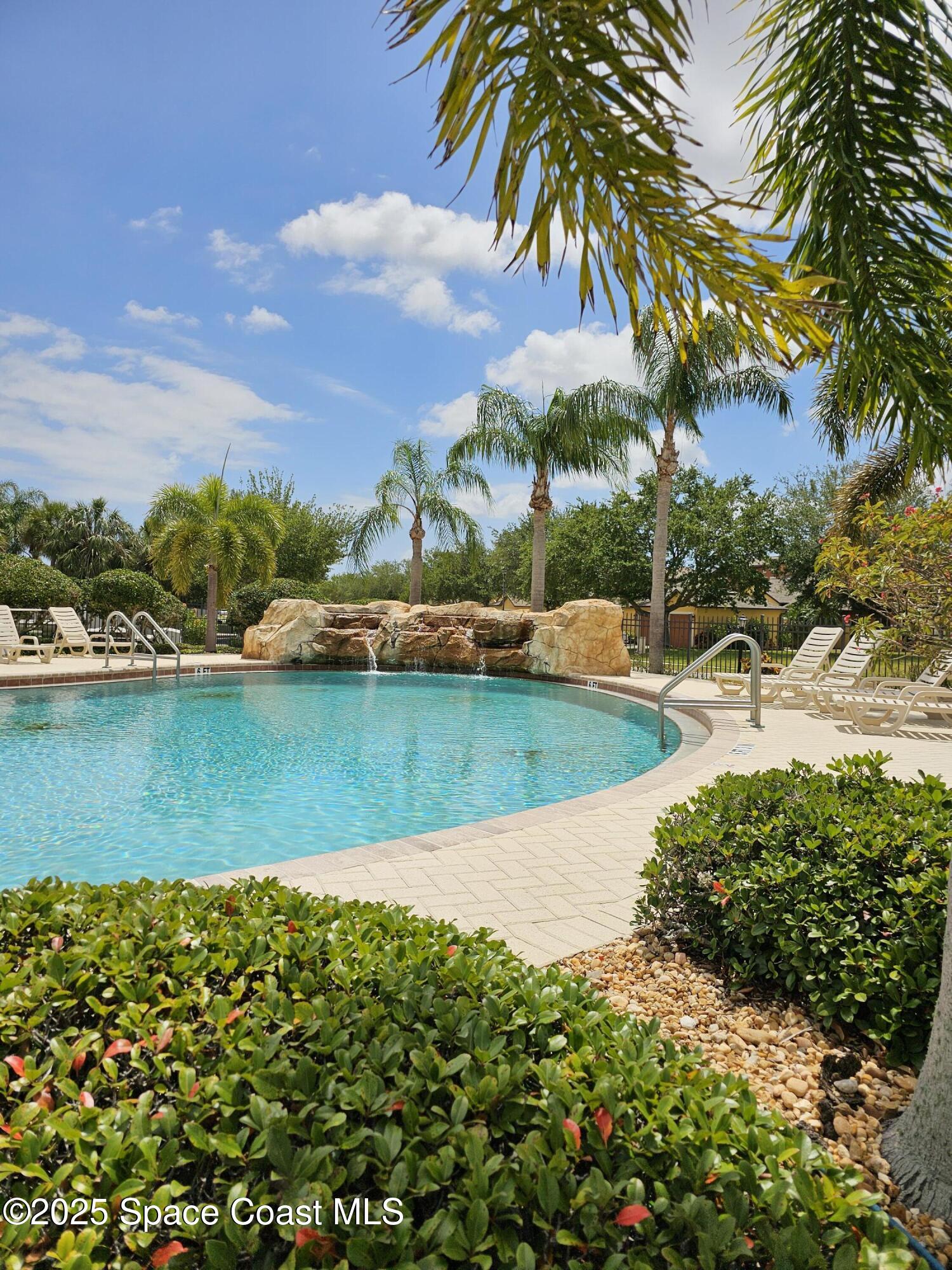 4570 Radiant Way, Unit 104 Melbourne, FL 32901 - Photo 33 of 41 a view of a lake with a beach