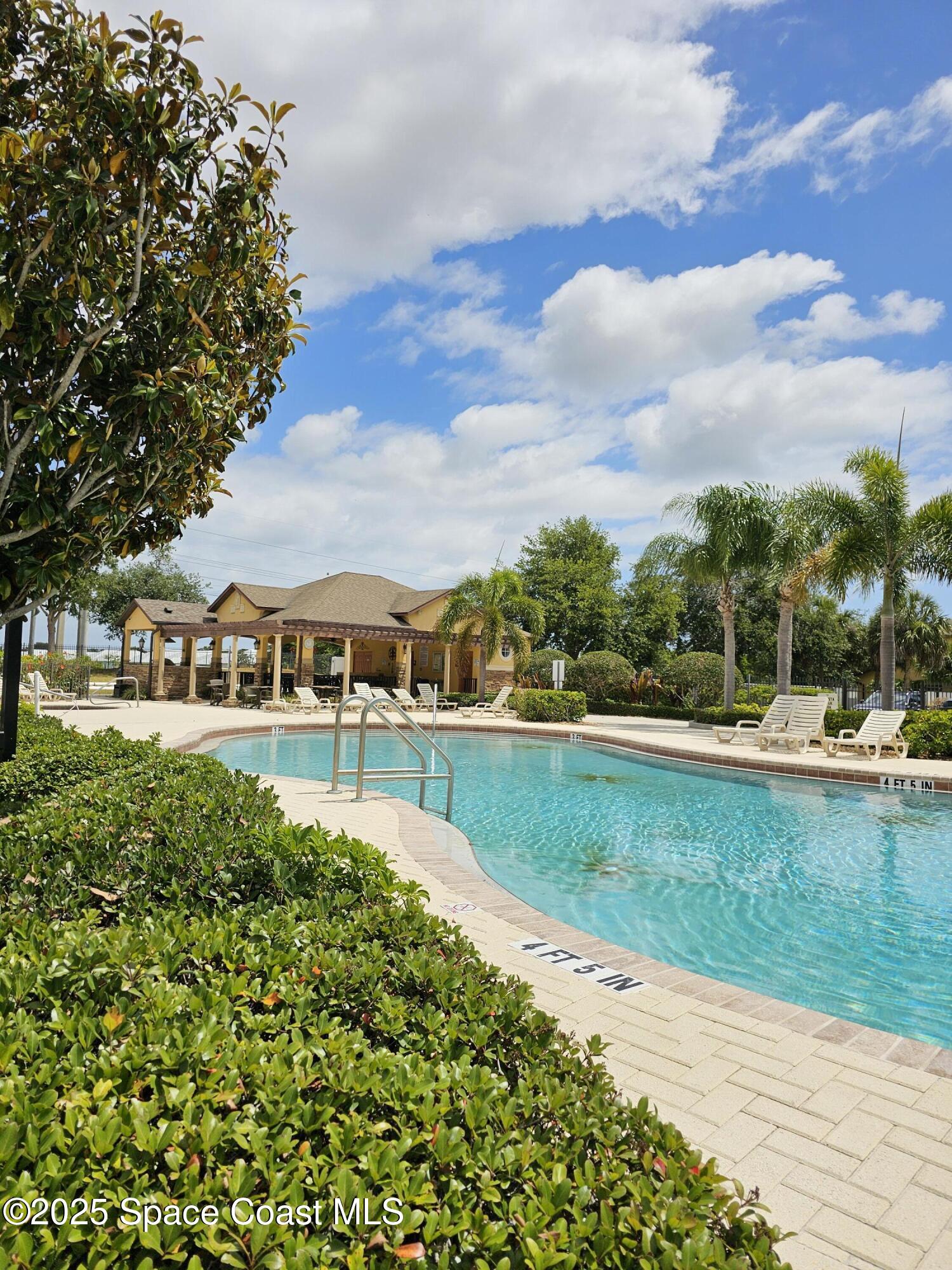 4570 Radiant Way, Unit 104 Melbourne, FL 32901 - Photo 34 of 41 a view of swimming pool and lake view