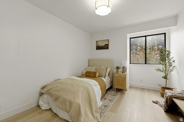 1175 Canyon Road, Unit 77 Ogden, UT 84404 - Photo 7 of 16 Bedroom featuring light wood-style floors