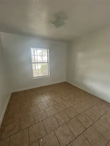 a view of a car parked in front of a house