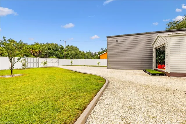 a view of a swimming pool with a garden and plants