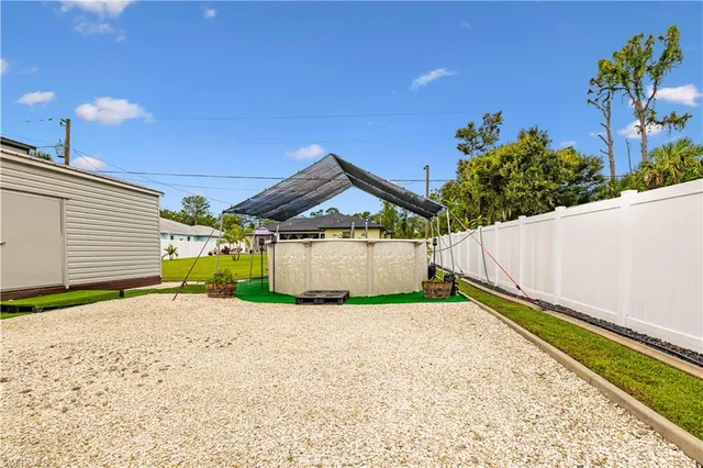 a view of a swimming pool with a patio