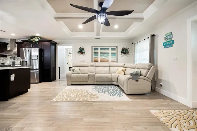 a kitchen with stainless steel appliances sink stove and cabinets