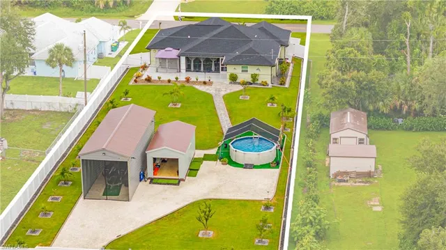 a aerial view of a house with swimming pool