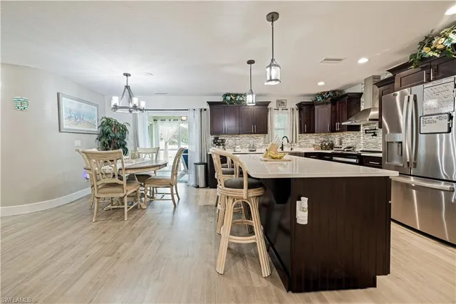 a bedroom with a bed and a table chair