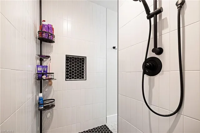 a bedroom with a bed and dresser