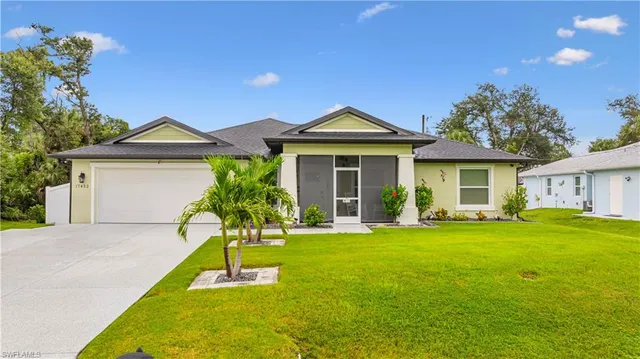 a front view of a house with a garden and porch