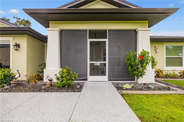 a front view of a house with garden