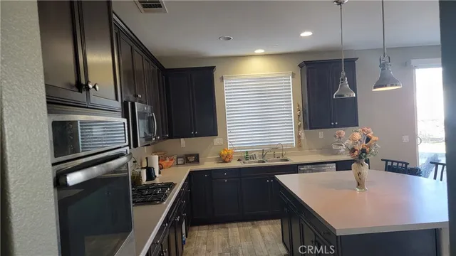 a bathroom with a double vanity sink a mirror and a bathtub