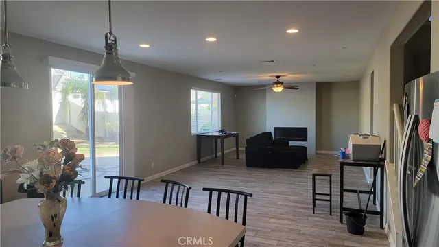 a view of a patio with table and chairs and potted plants