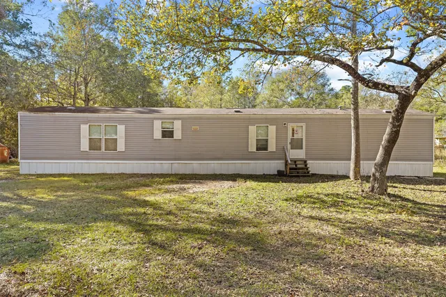 a house view with a garden space