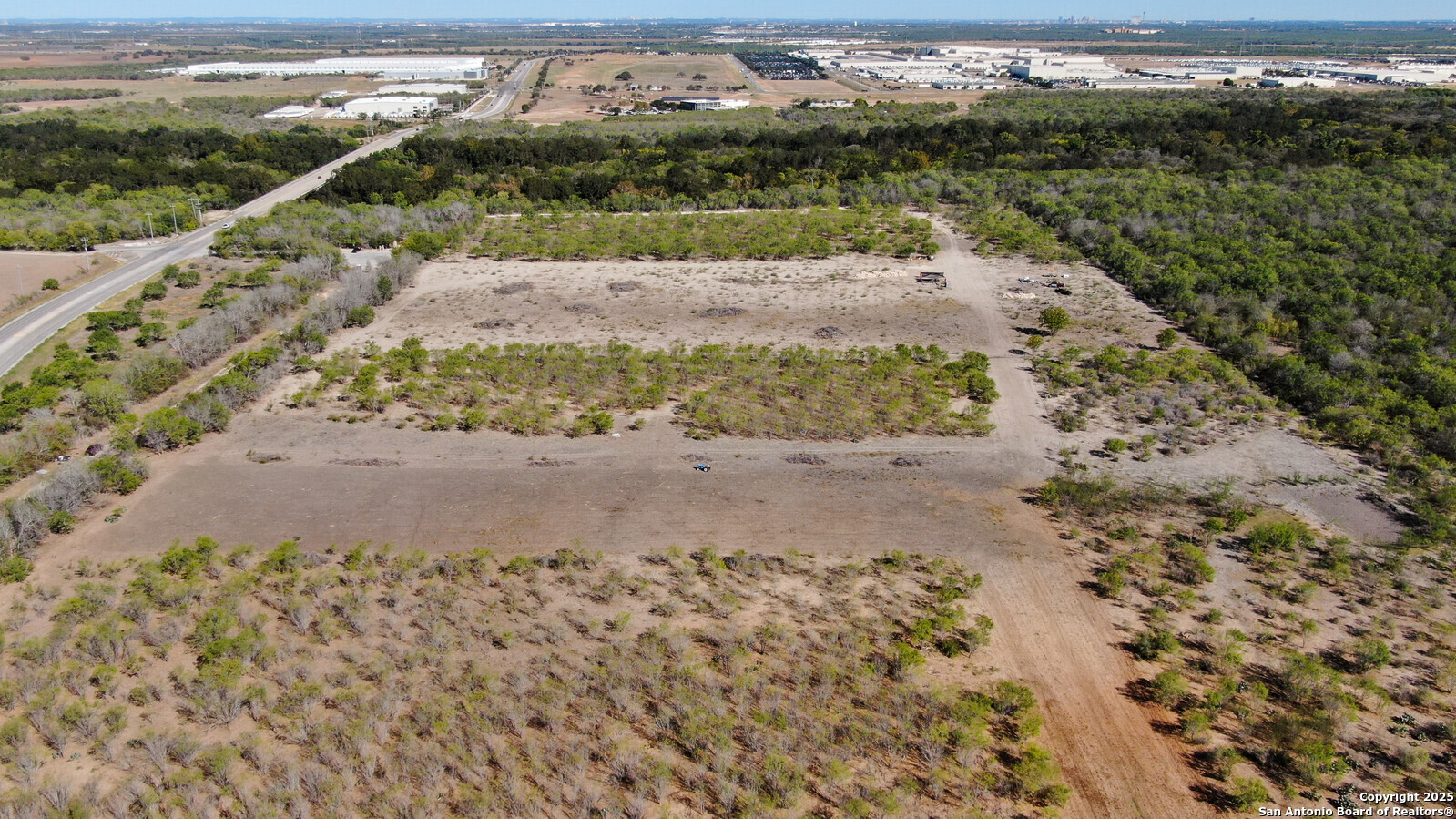 0 Applewhite Road San Antonio, TX 78264 - Photo 9 of 22 a view of a road with a yard