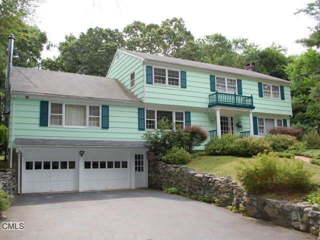 9 Rices Lane Westport, CT 06880 - Photo 1 of 1 a front view of a house with a yard