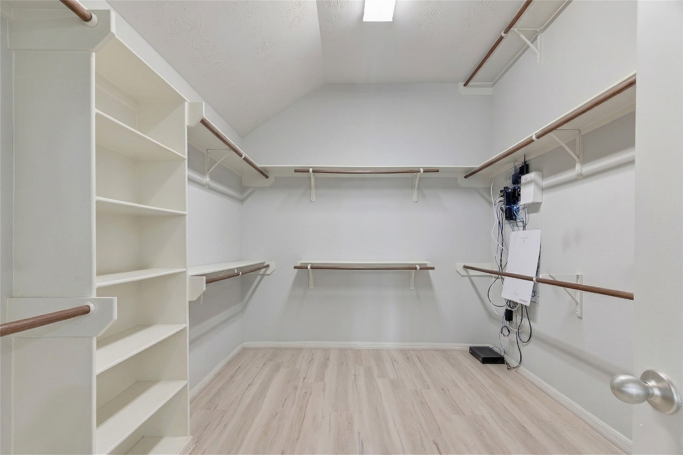 13415 Star Creek Lane Rosharon, TX 77583 - Photo 22 of 46 a view of a room with racks on the wall