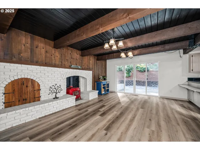 a view of a kitchen with wooden floor
