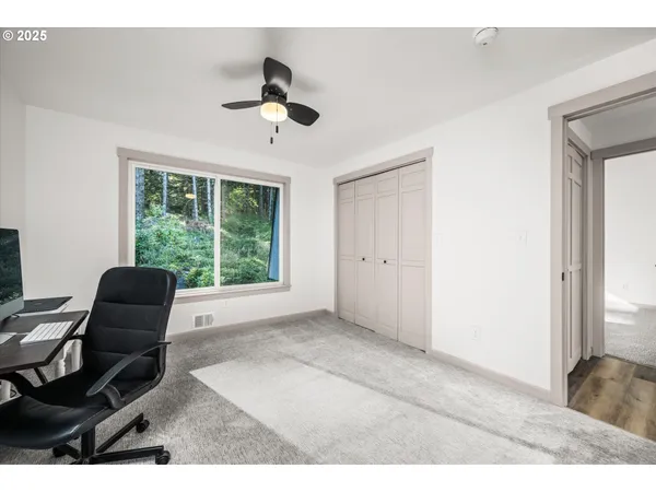 a view of an empty room with a window