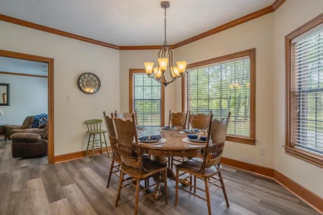 a dining room with furniture window wooden floor