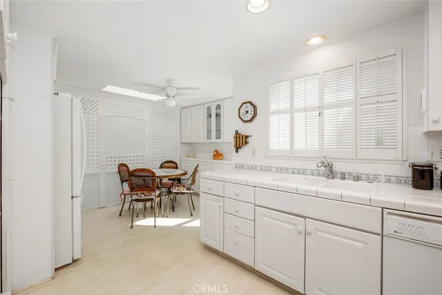 a kitchen with a sink and a refrigerator