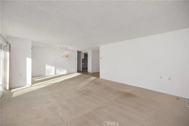 a view of an empty room with a fireplace