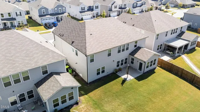 a view of a house with backyard porch and sitting area