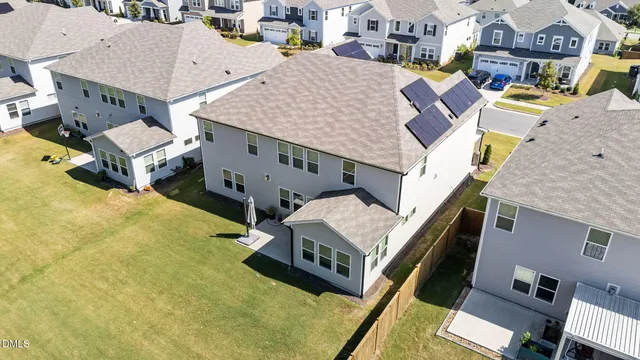 a view of a white house with a large windows