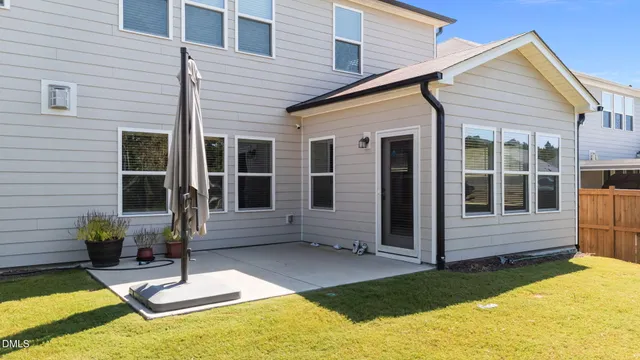 a view of a livingroom with furniture and stairs
