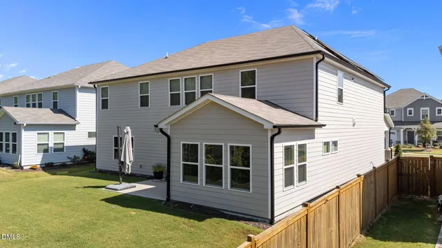 a view of a livingroom kitchen and dining room with wooden floor