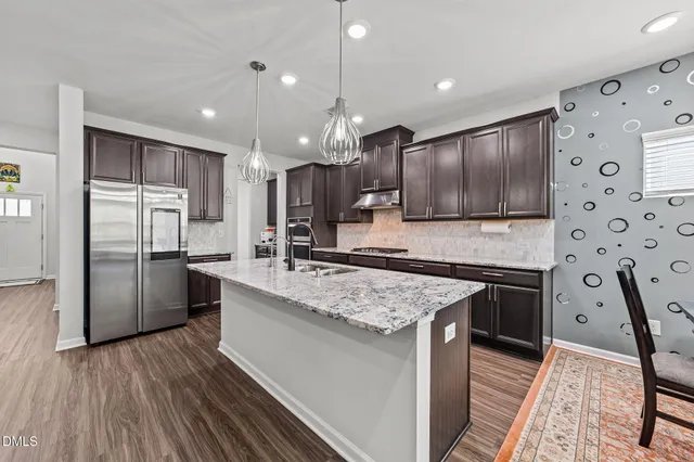 a spacious bedroom with a bed and a large window